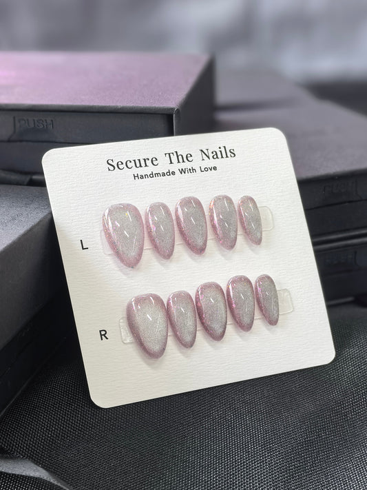 Unique Silver Pink Cat-Eye Handmade Press-On Nails in Short Almond with large hidden glitter sparkles | Secure The Nails