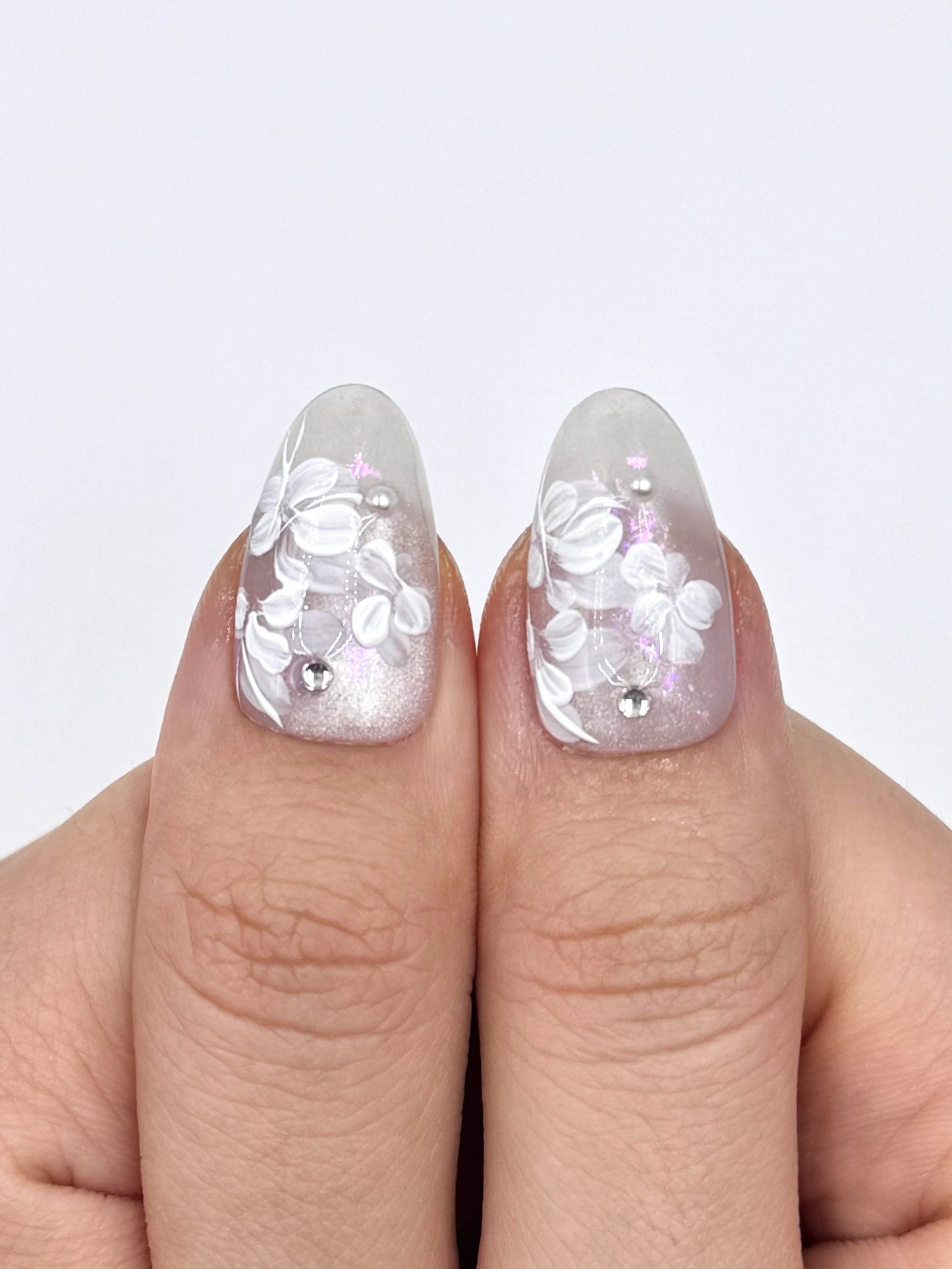 Glowy Silver White Cat-Eye Oval Press-On Nails with Handpainted White Florals, Shiny Crystal Jewelry and Pink Shimmer