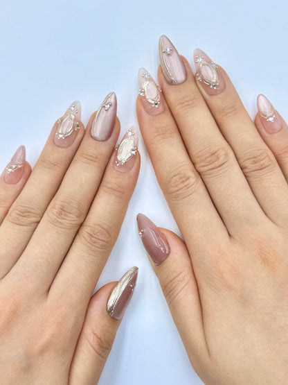 Shimmery Champagne Pink Nude Cat-Eye Almond Press-On Nails with Gold Chrome Frame and Crystal Jewelry