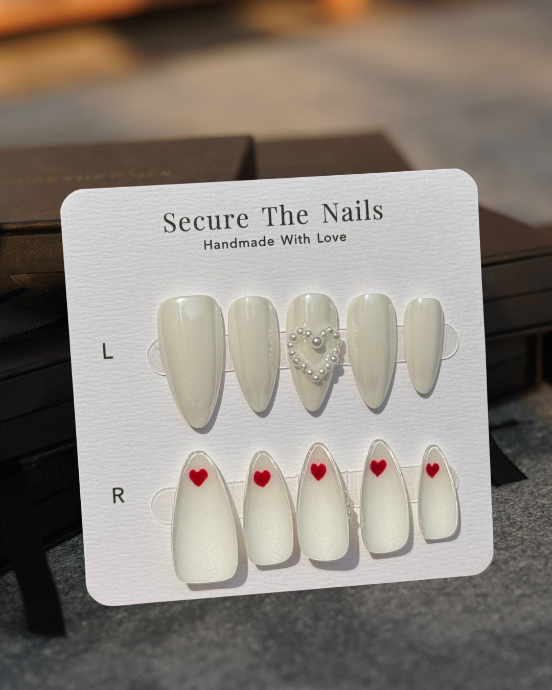 Pearlescent Glowy White Almond Valentine's Press-On Nails with Pearl Heart and Hidden Red Hearts, Reusable & Long-Lasting | Secure The Nails
