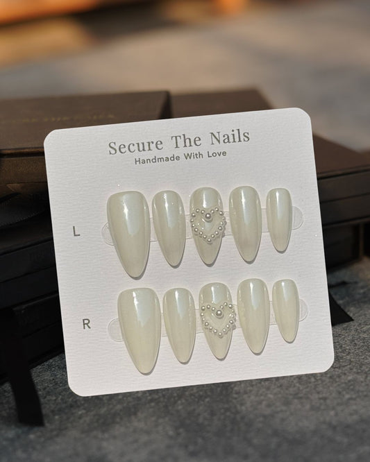 Glossy White Almond Cute Valentine's Press-On Nails with Pearl Heart and Unique Hidden Red Hearts, Reusable & Long-Lasting | Secure The Nails