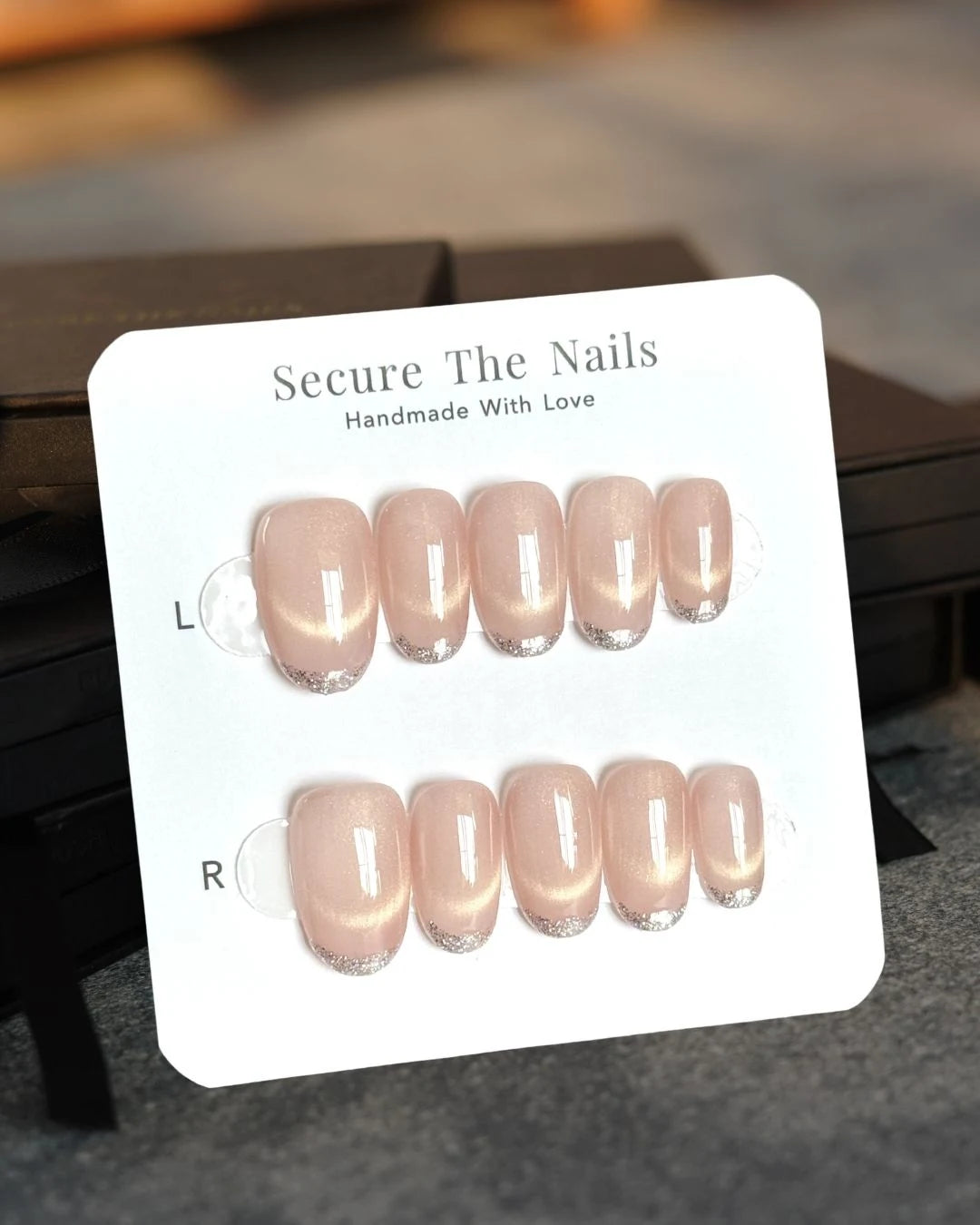 Peachy Nude Glowy Cat-Eye Oval Press-On Nails with Smiley Line French Tips and Glittery Outline