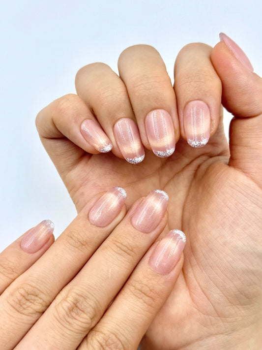 Glowy Peachy Nude Cat-Eye Oval Press-On Nails with Smiley Line Golden French Tips and Glitters