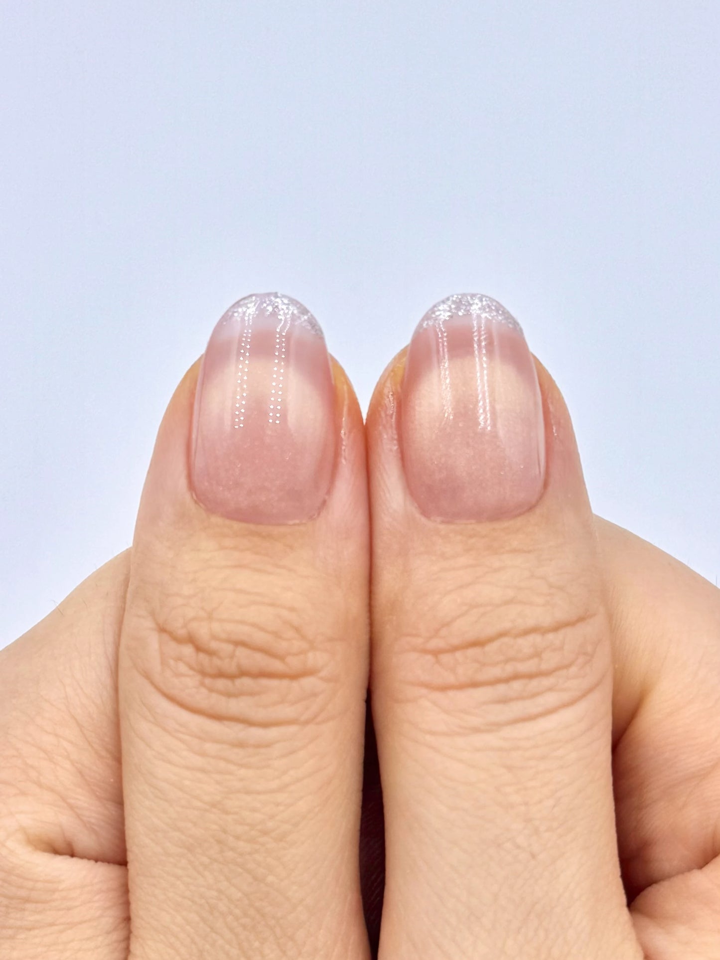 Glowy Soft Peach Blush Nude Cat-Eye Oval Round Press-On Nails with Smile Line French Tip and Silver Glitter