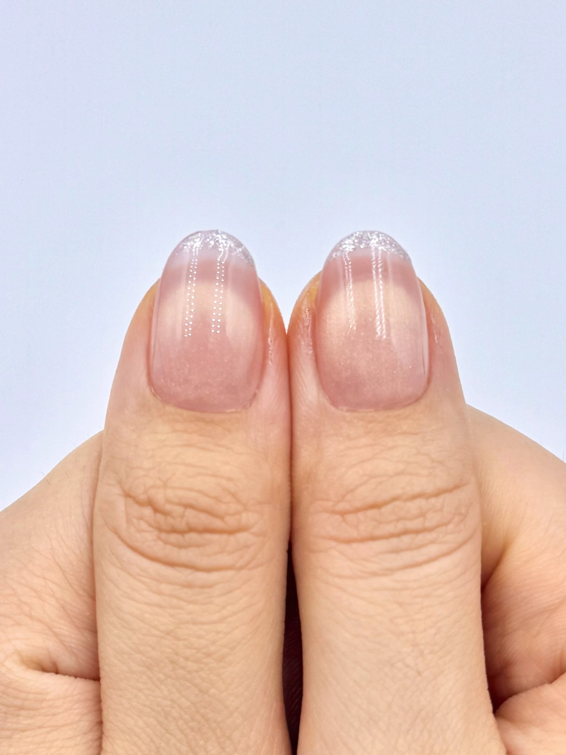 Glowy Soft Peach Blush Nude Cat-Eye Oval Round Press-On Nails with Smile Line French Tip and Silver Glitter