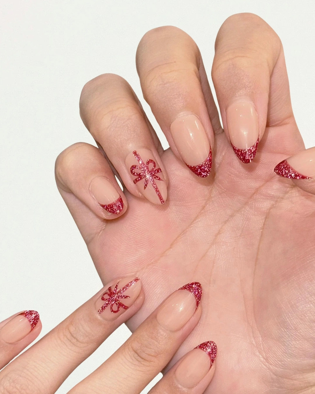 Cute Elegant Christmas Holiday Festive Short Almond Red French Tips with Gift Ribbon Press-On Nails, Sparkly Glittery Reflective Gel | Secure The Nails