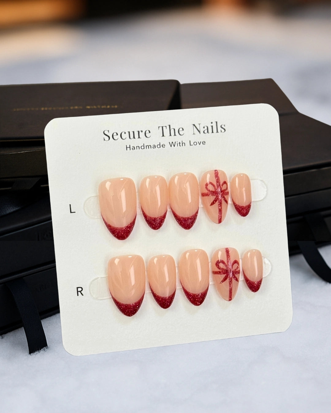 Christmas Holiday Festive Short Almond Press-On Nails, Red French Tips with Ribbon, Sparkly Reflective Gel | Secure The Nails