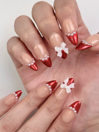 Cute Elegant Christmas Holiday Red Chrome Almond French Tip Press-On Nails with Pearls and Bow Ribbon Girly Winter Nail Art | Secure The Nails
