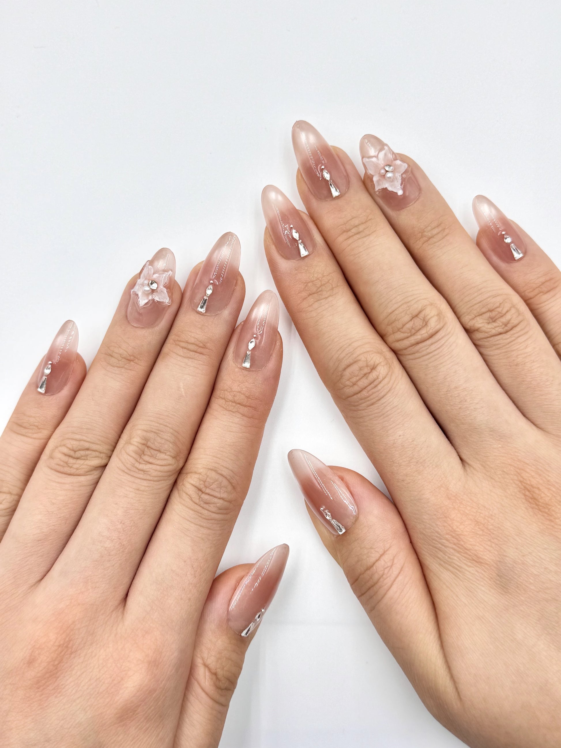 Glowy Nude Cat-Eye Almond Oval Press-On Nail with Shiny Crystal Jewelry and 3D Gel Pink Flower on Ring Finger