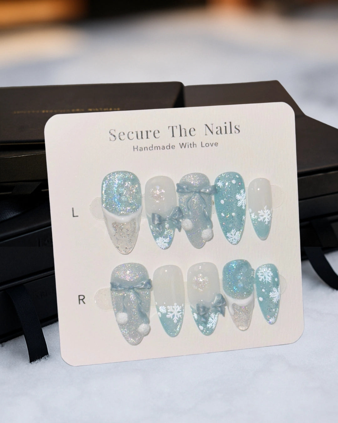 Christmas Holiday Snowflake Bow Ribbon Almond French Tip Press-On Nails with Fluffy Pom-Poms, Cute Unique Winter Nail Art | Secure The Nails