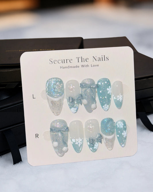 Christmas Holiday Snowflake Bow Ribbon Almond French Tip Press-On Nails with Fluffy Pom-Poms, Cute Unique Winter Nail Art | Secure The Nails