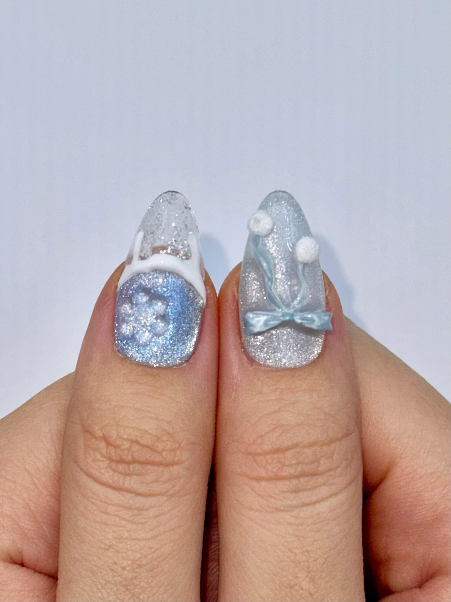 Christmas Holiday Snowflake Bow Ribbon Almond French Tip Press-On Nails with Fluffy Pom-Poms, Unique Cute Girly Winter Snow Ice Blue Nail Art | Secure The Nails