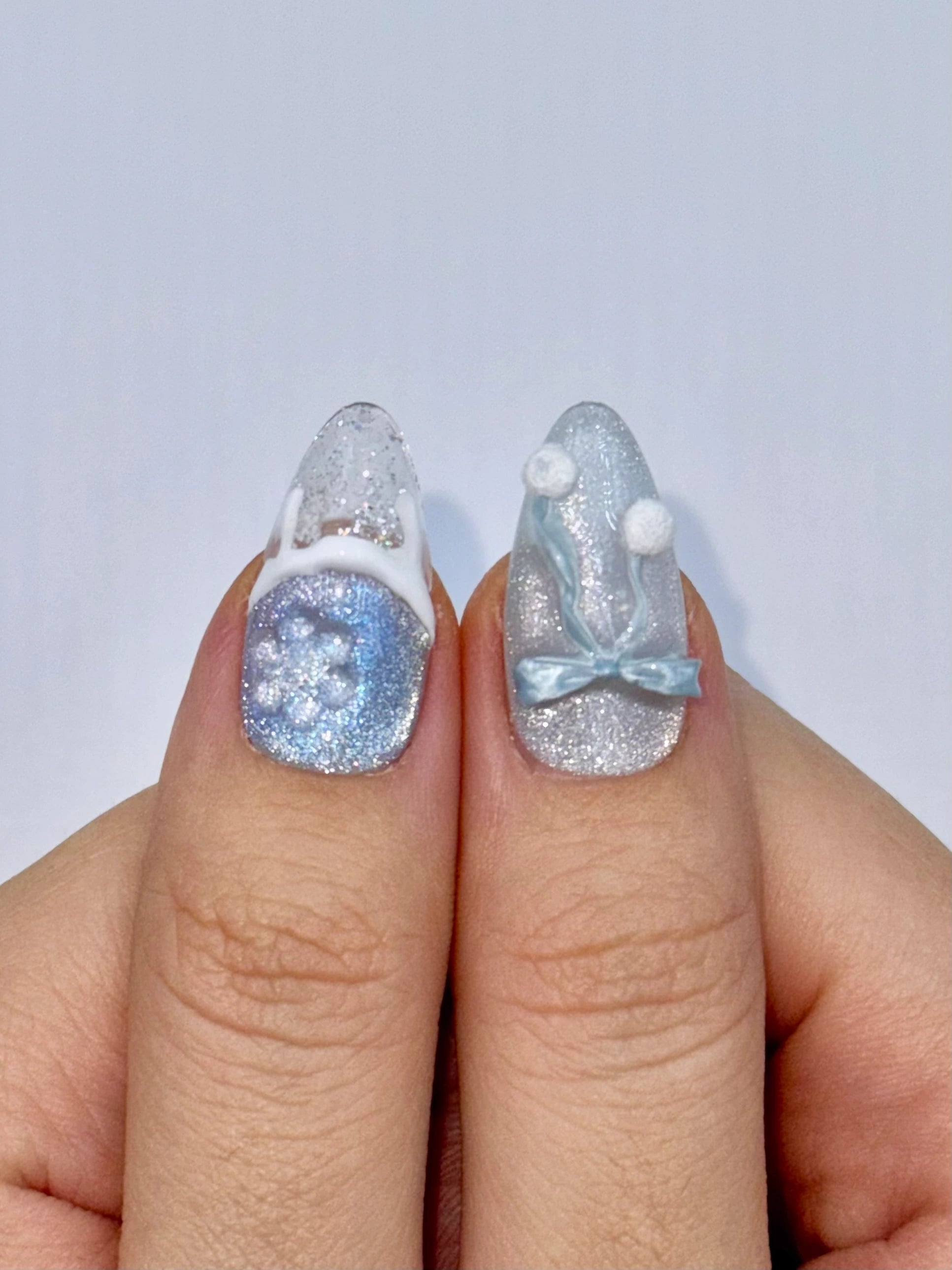 Christmas Holiday Snowflake Bow Ribbon Almond French Tip Press-On Nails with Fluffy Pom-Poms, Unique Cute Girly Winter Snow Ice Blue Nail Art | Secure The Nails