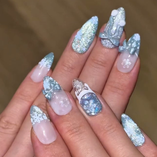 Christmas Holiday Snowflake Bow Ribbon Almond French Tip Press-On Nails with Fluffy Pom-Poms, Cute Unique Glittery Winter Nail Art | Secure The Nails