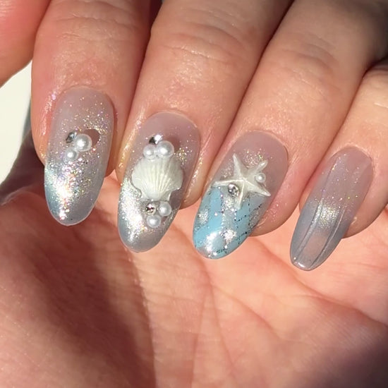 Silver blue cat-eye press-on nails with seashell, starfish, pearl, and tropical 3D details | Secure The Nails