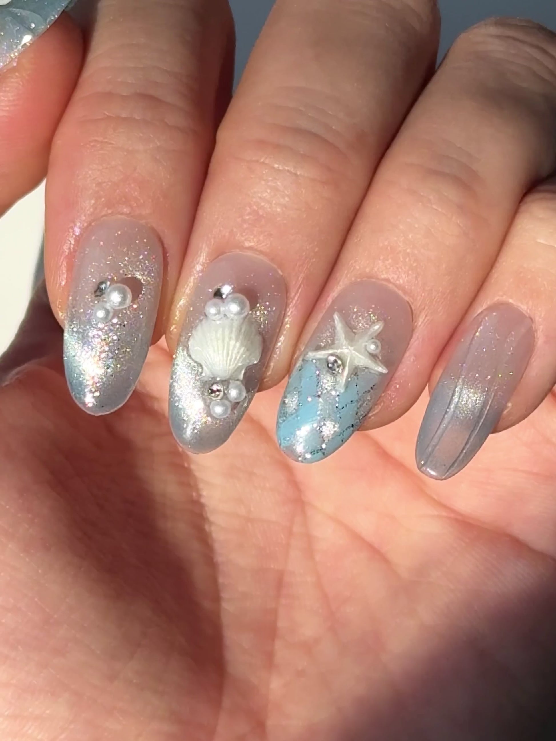 Silver blue cat-eye press-on nails with seashell, starfish, pearl, and tropical 3D details | Secure The Nails